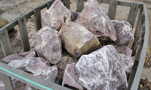 expert landscape supply carrying boulders and patio stone